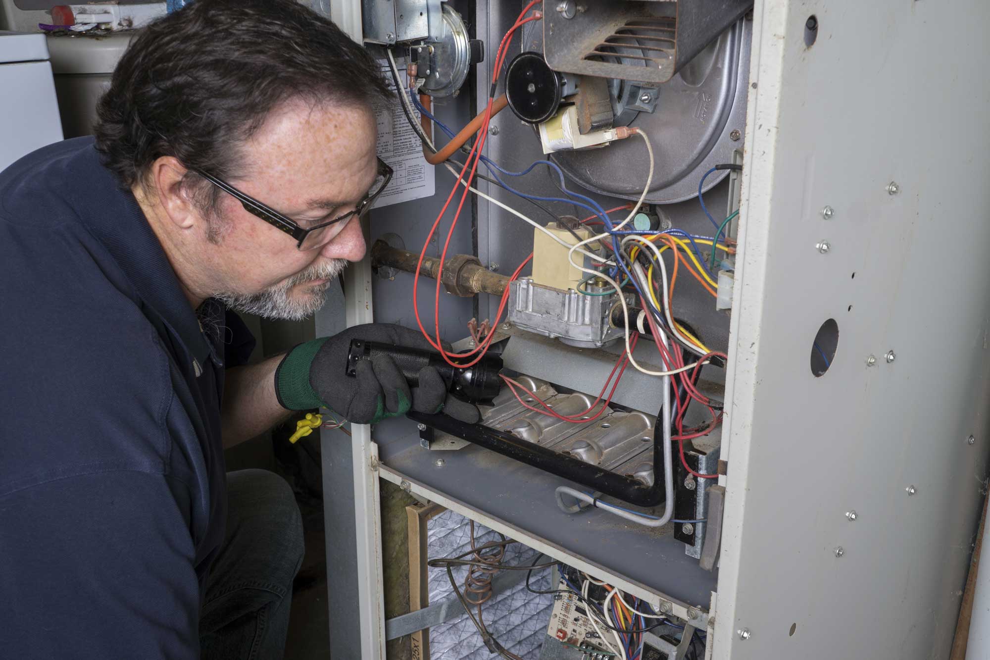 Man fixing furnace.