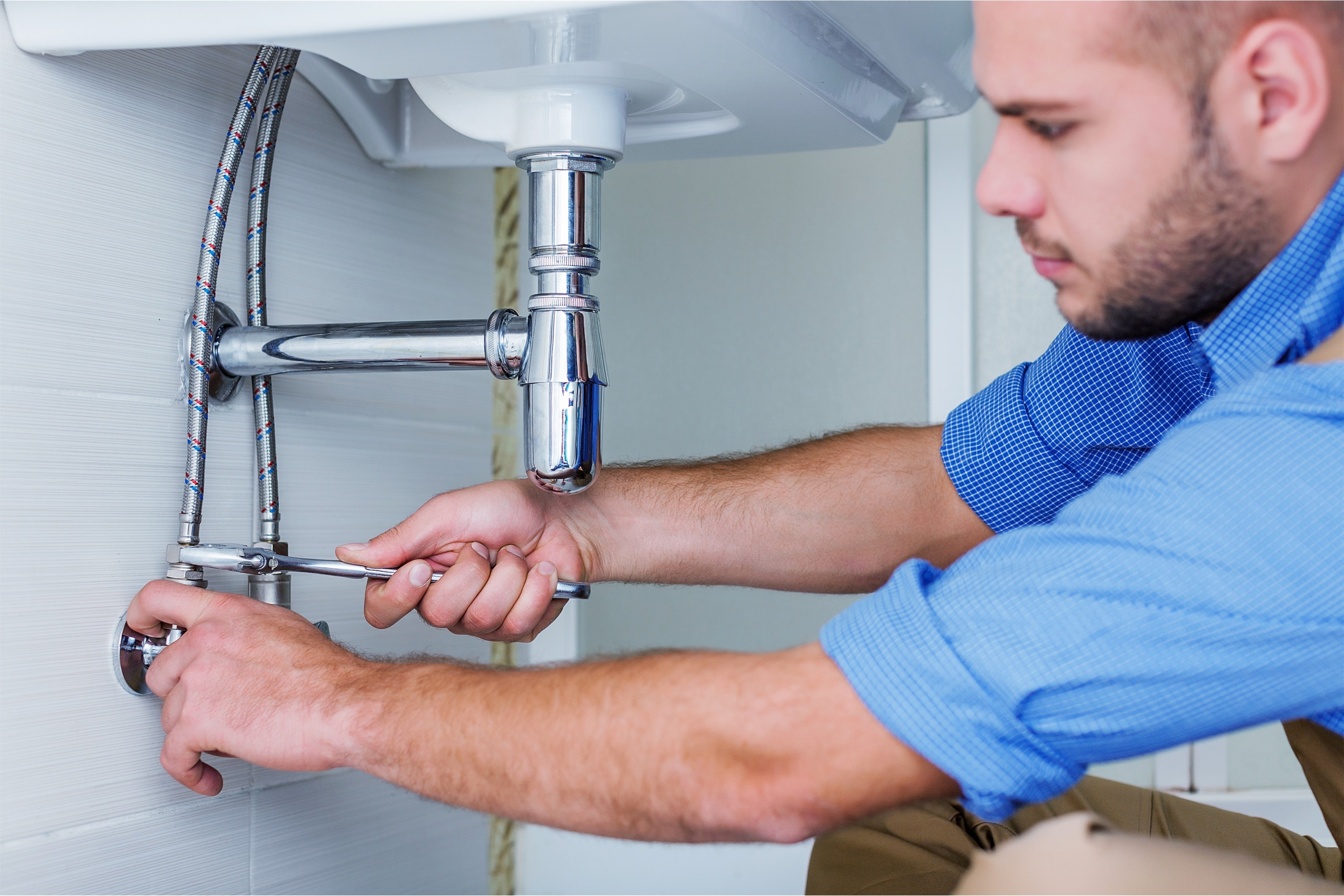 plumbing services being performed by a plumber