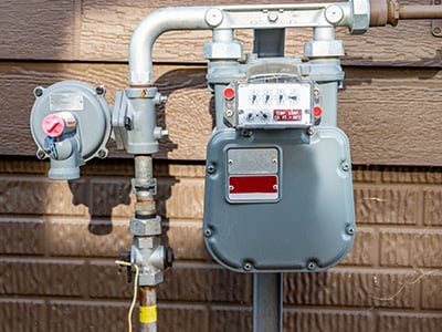 A gas meter outside a house