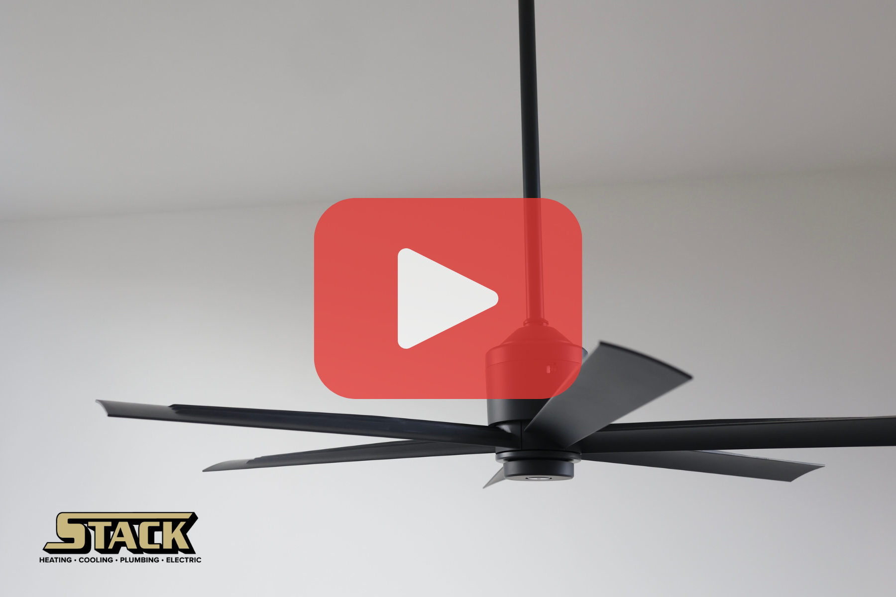 Black celing fan with red play buttom overaly.