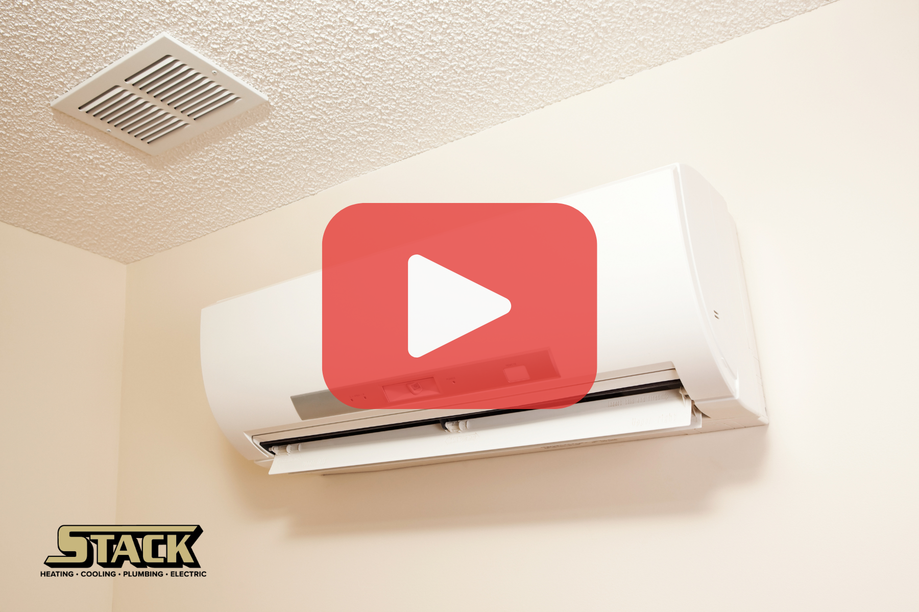 Mini split on wall woth red play buttom overlay.