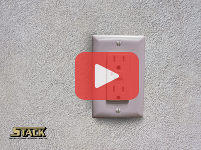 GFCI outlet. Red play buttom overlay and Stack logo.