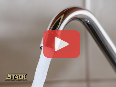 Opened water faucet. Red play buttom overlay and Stack logo.